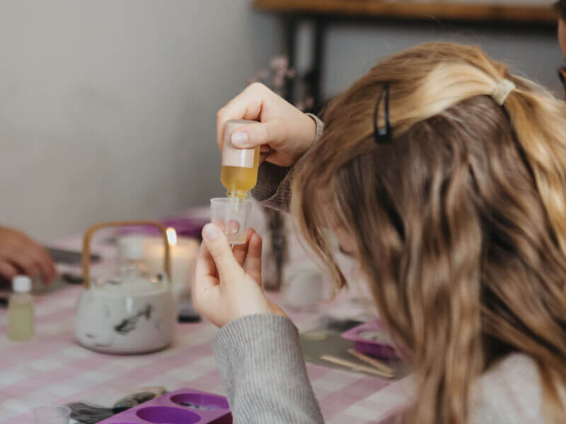 A girl makes her own skincare at a workshop